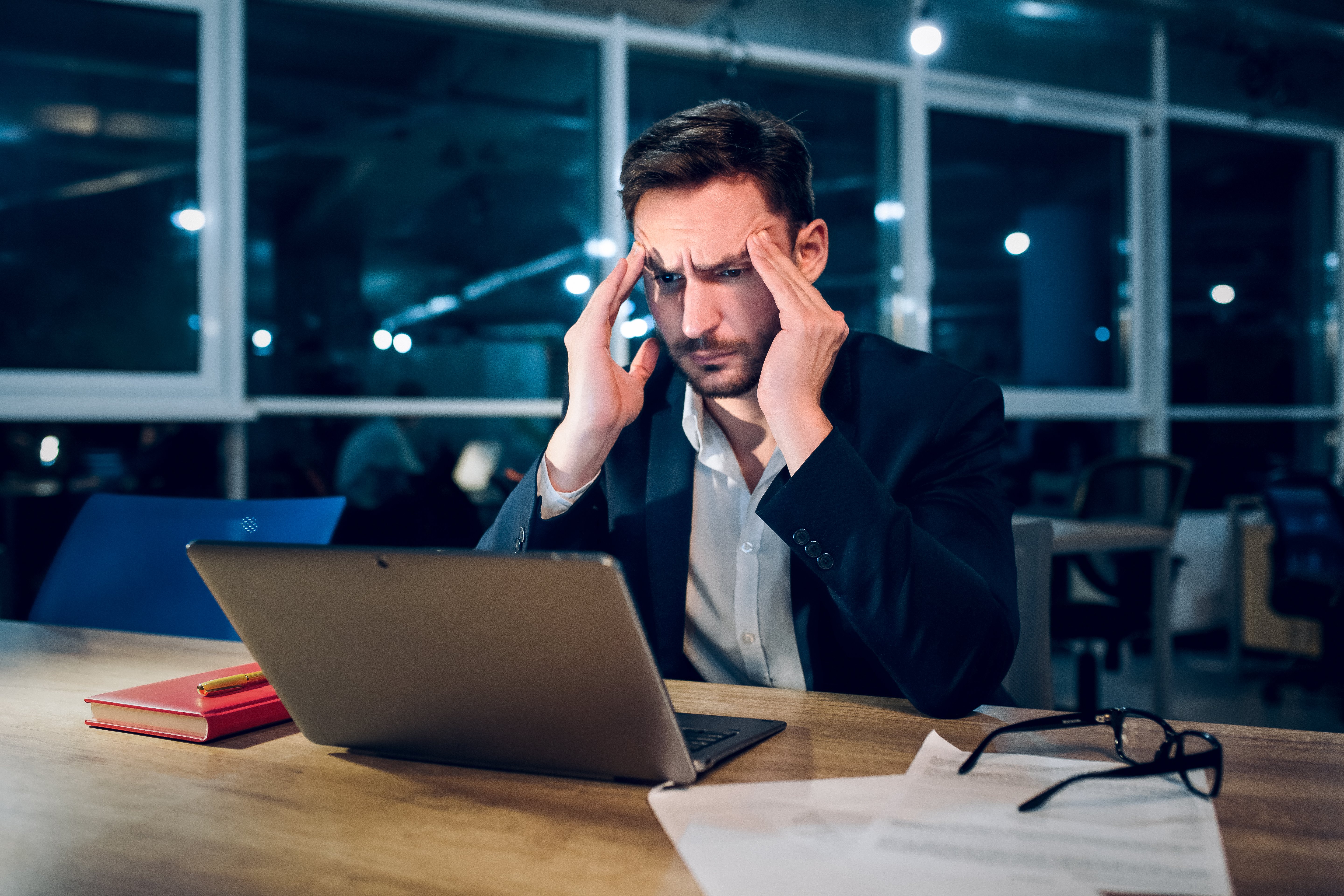 weary-businessman-finishing-up-work-night